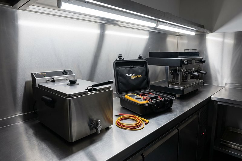 Testing appliances on a commercial kitchen worktop